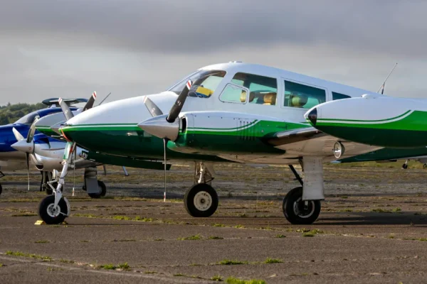 Small twin-engine airplane on runway representing FAA Aviation Medical Exams by Dr. Phanor Calle, Aviation Medical Examiner in Weston, Florida.