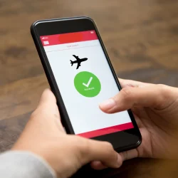 Patient displaying an FAA medical exam appointment confirmation number on a smartphone before an appointment at Weston Medical Clinic.