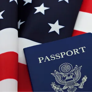U.S. passport and American flag representing USCIS Form I-693 immigration medical examinations at Weston Medical Clinic
